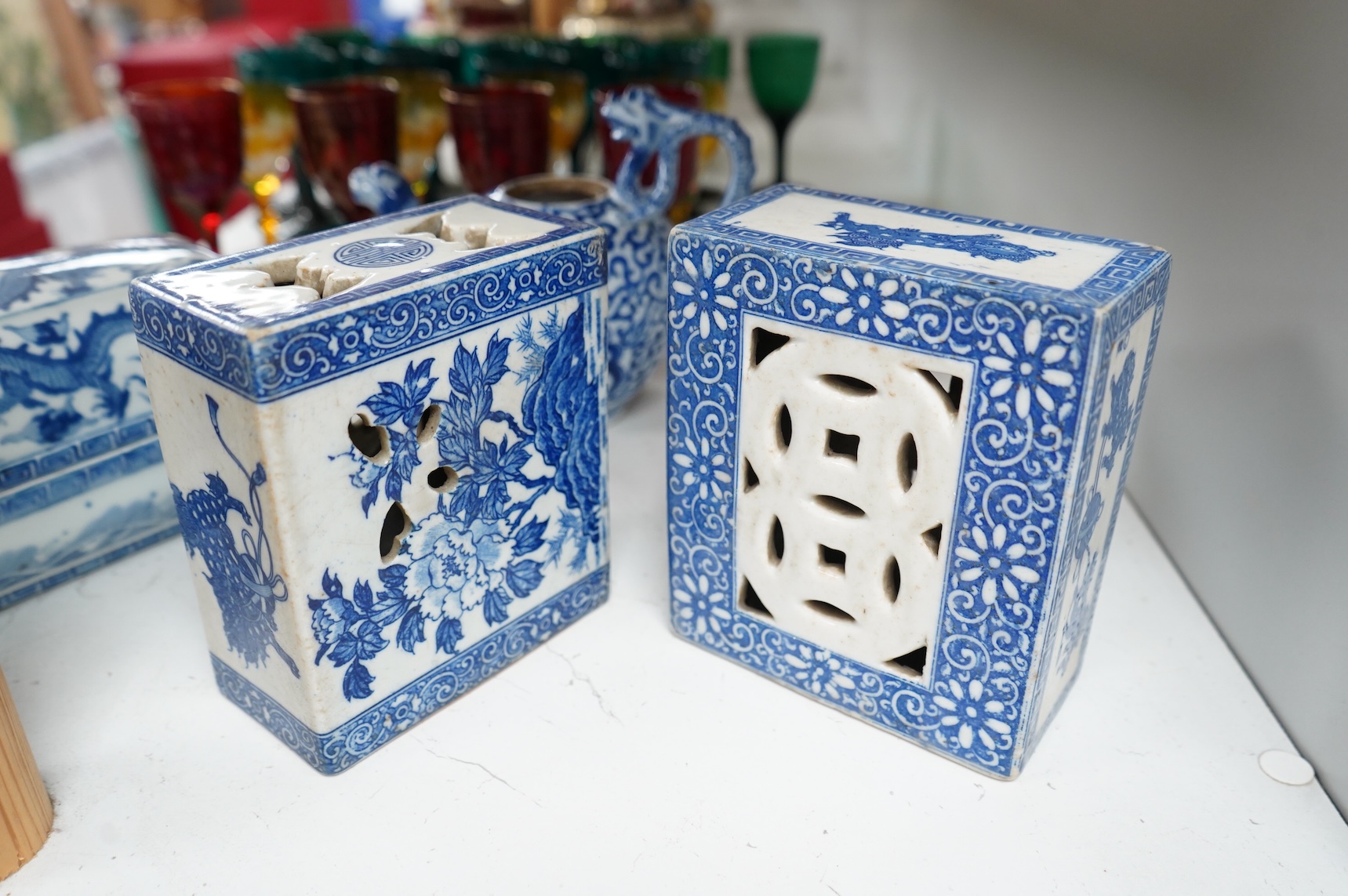 A group of Chinese blue and white comprising a dish and cover, two pillows, waterdropper and a teapot, largest 26cm wide
